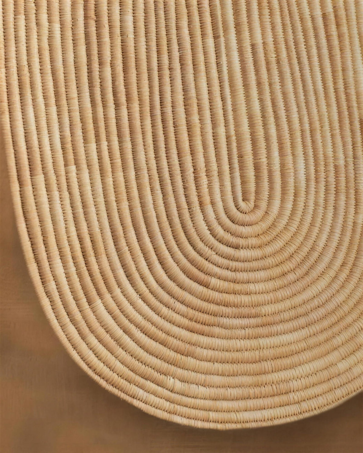 Close-up of the woven lines on the rounded shield of Abstract Wall Mask 1