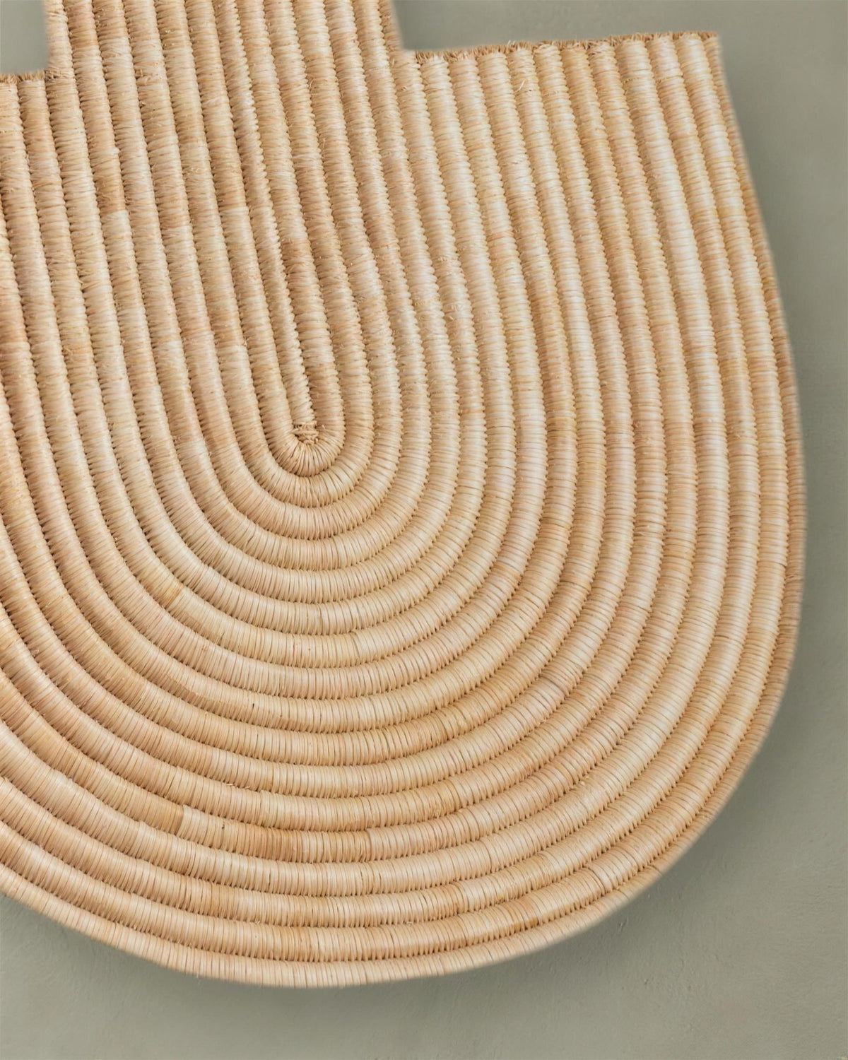 Close-up of woven rows curving around the rounded base of Abstract Wall Mask 2
