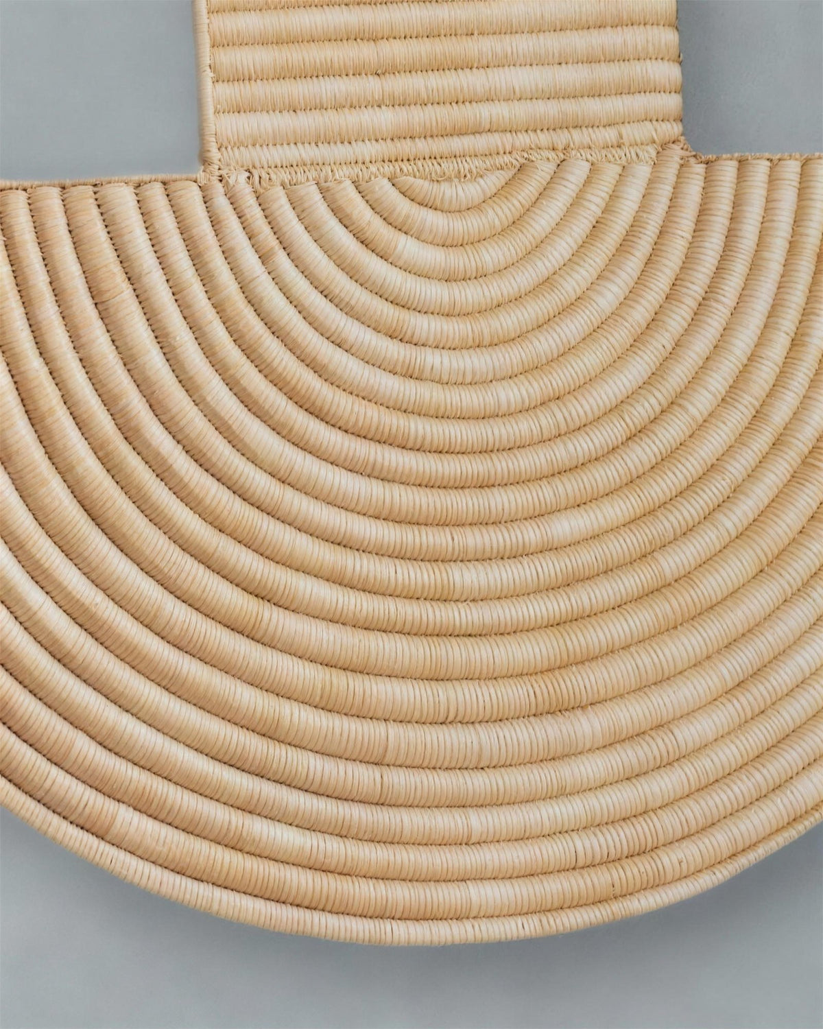 Close-up of the woven half-circle base of Abstract Wall Mask 3, rows curving in arcs