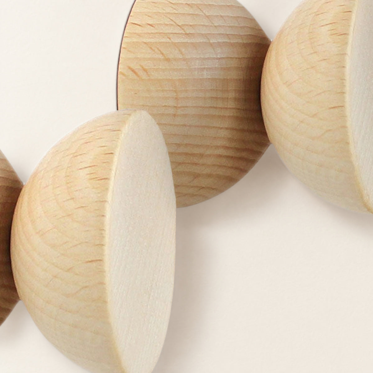 Close-up of the beech hooks’ flat faces and turned wood grain