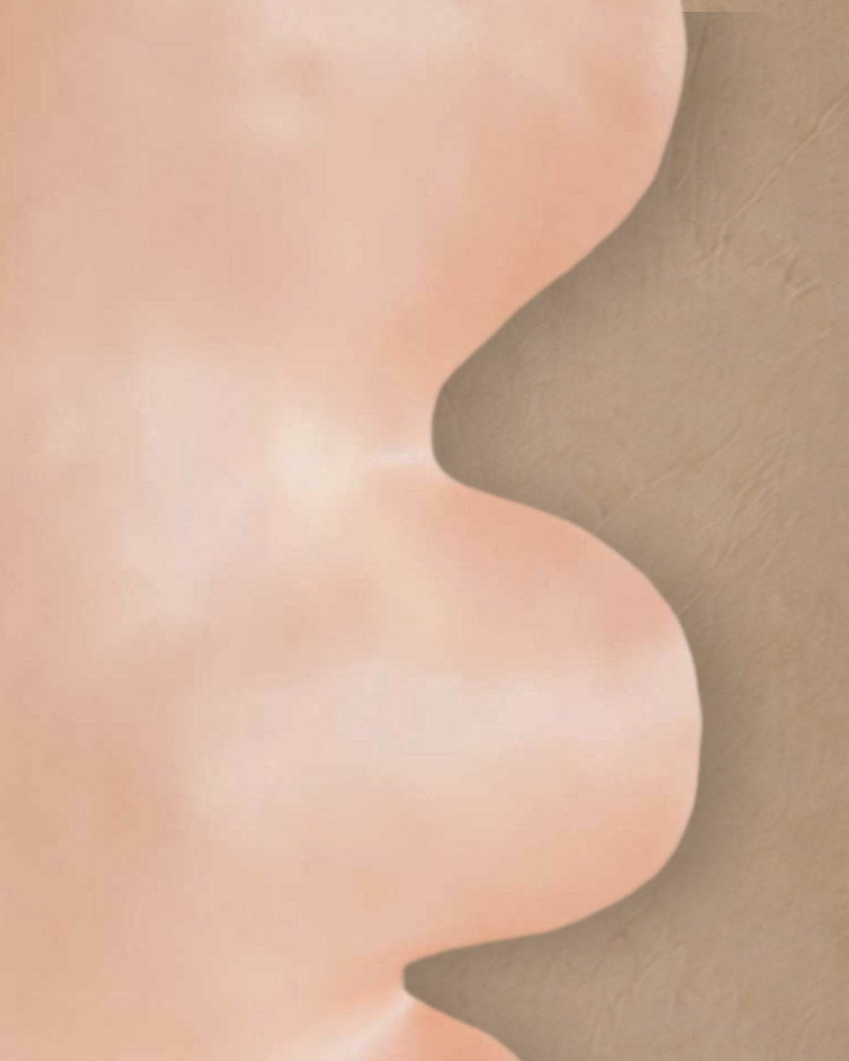 Close-up of the wavy side of the Fluxo large pink vase in its soft pink glaze