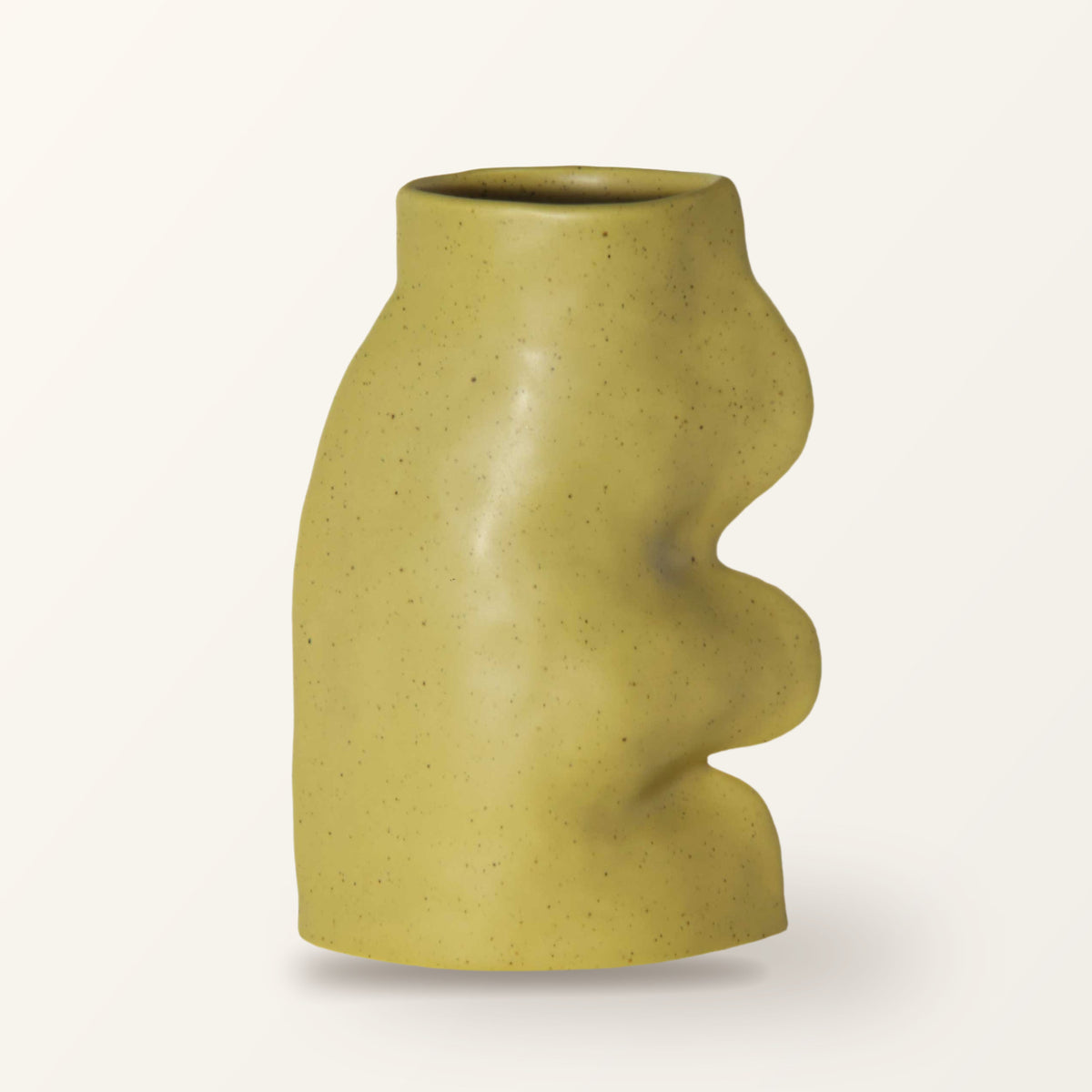 Fluxo large ceramic vase in pistachio green with a wavy side, on a plain warm-white backdrop