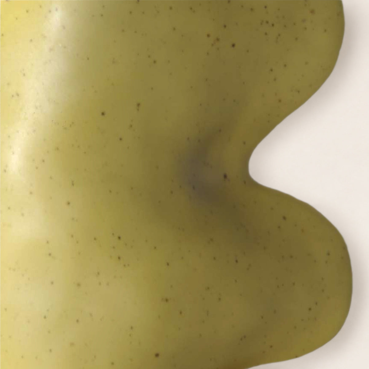 Close-up of the Fluxo pistachio green vase: matte pistachio glaze with fine speckles