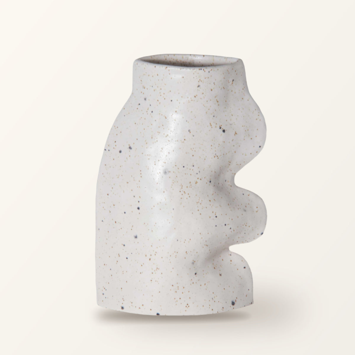 Fluxo large ceramic vase in white with a wavy side, on a plain warm-white backdrop