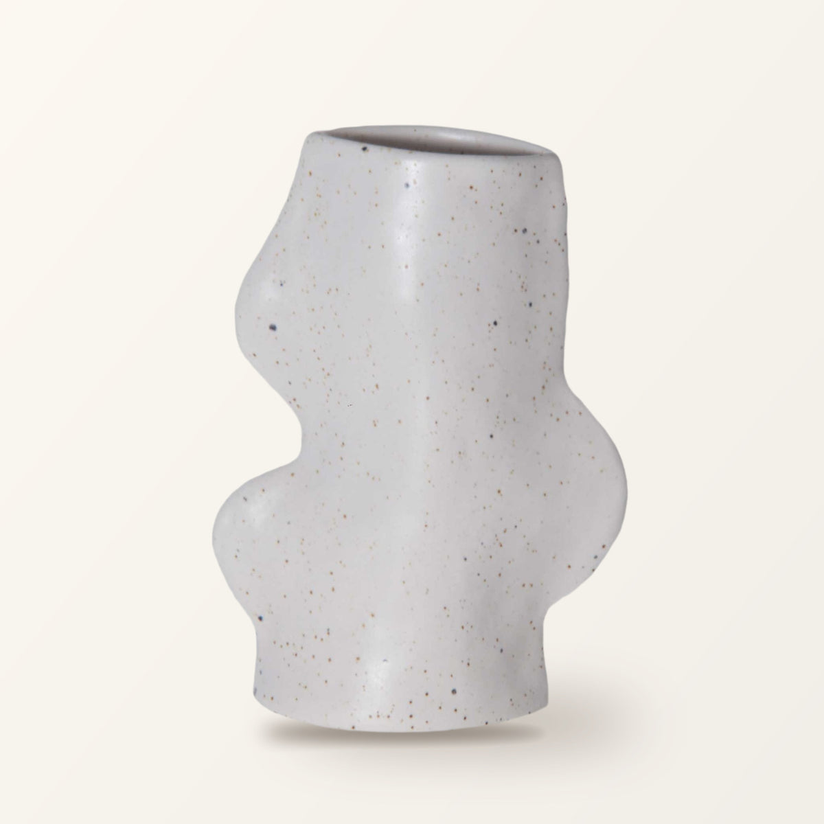 Fluxo medium ceramic vase in white with a wavy side, on a plain warm-white backdrop