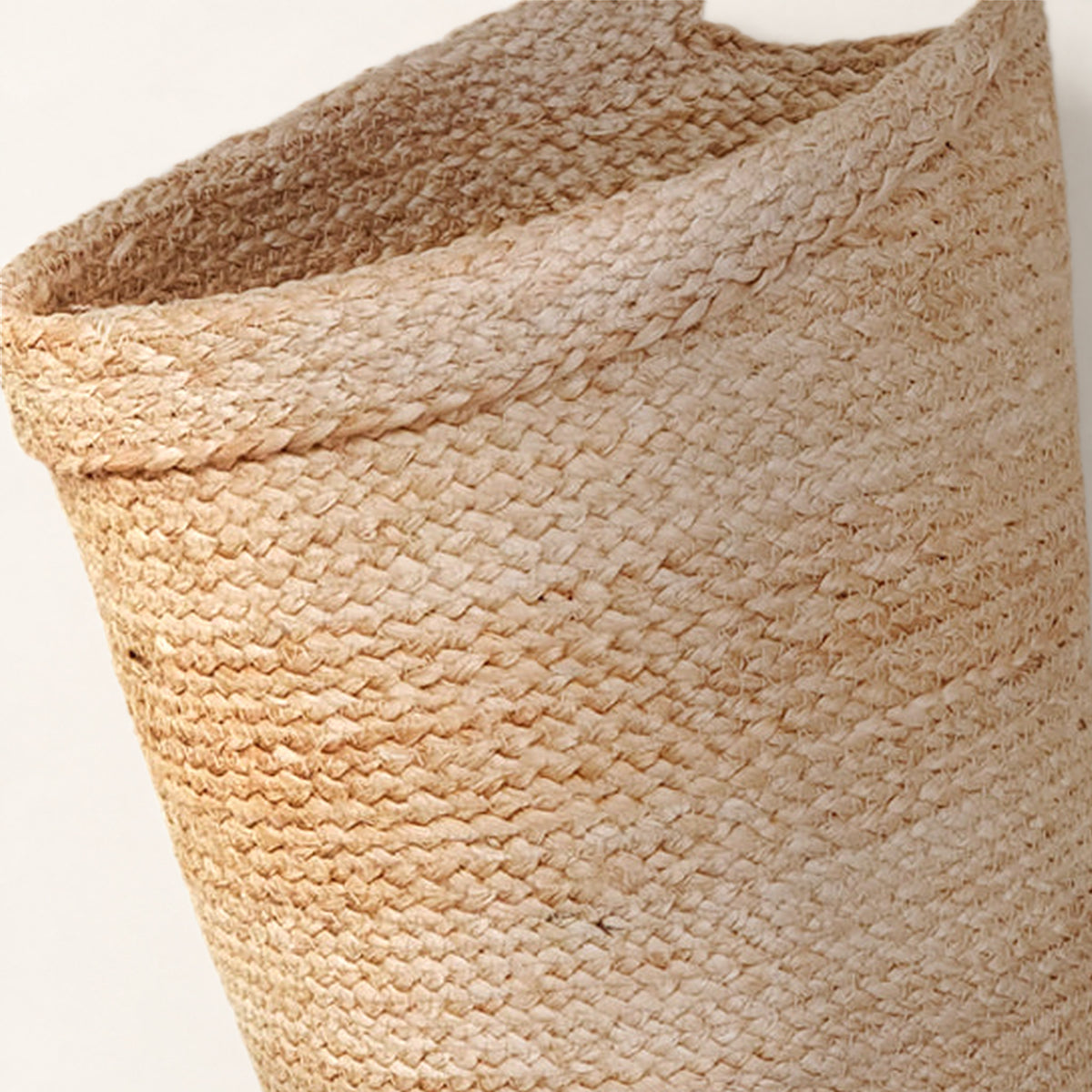 Close-up of the Kata basket's braided jute rim and weave