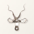 Kudu antelope mask of recycled car tin with spiralling horns, white paint worn back to bare metal; colour varies