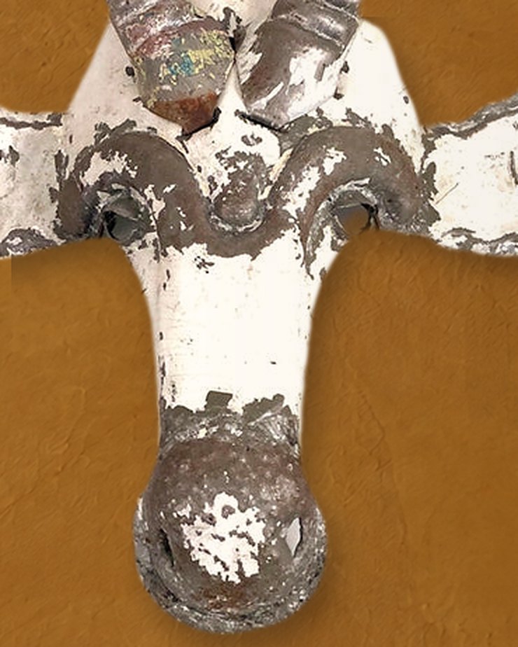 Close-up of the Kudu mask’s brow, face and round nose, white paint worn back to bare metal