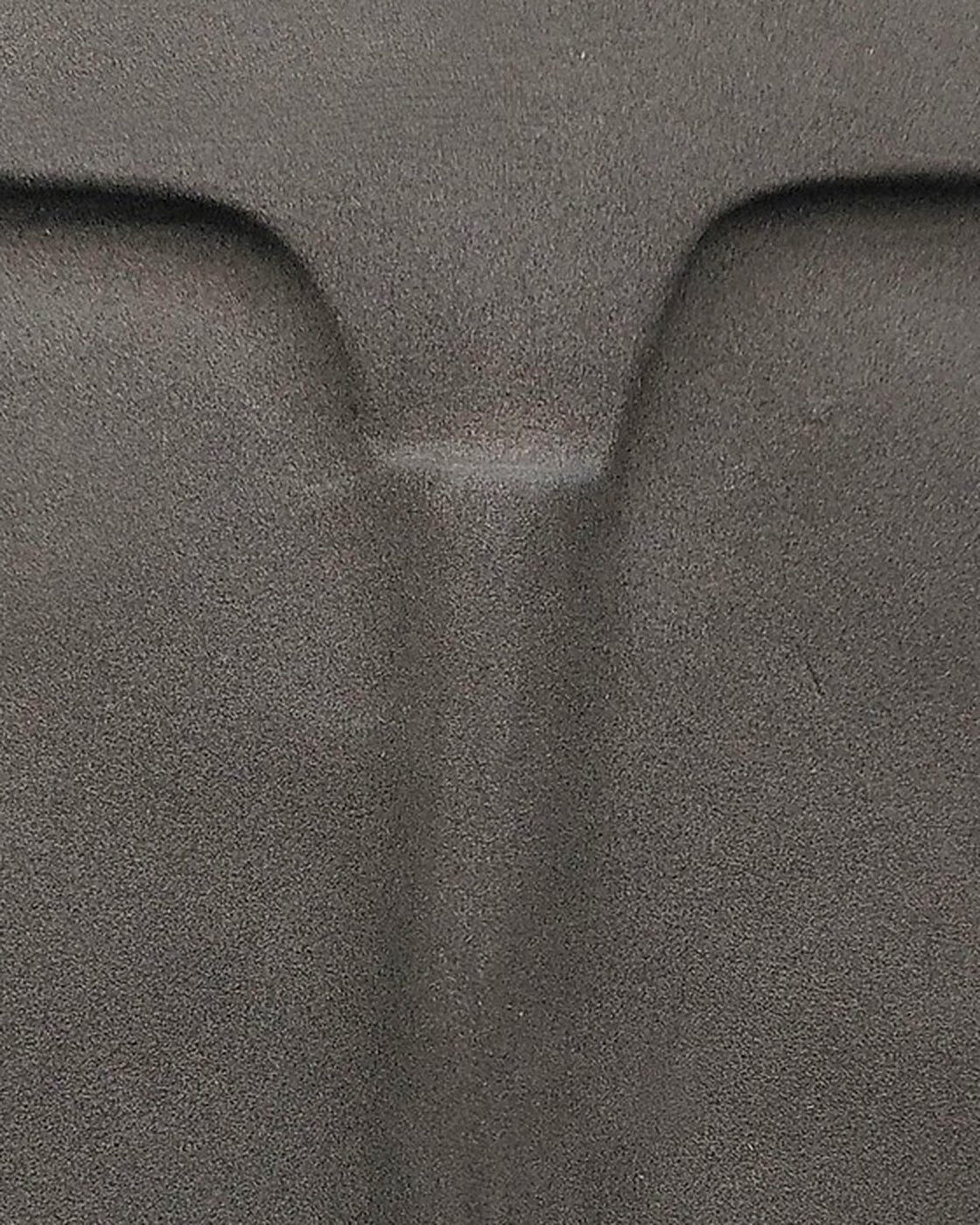 Close-up of the raised brow and nose of the anthracite ceramic wall mask