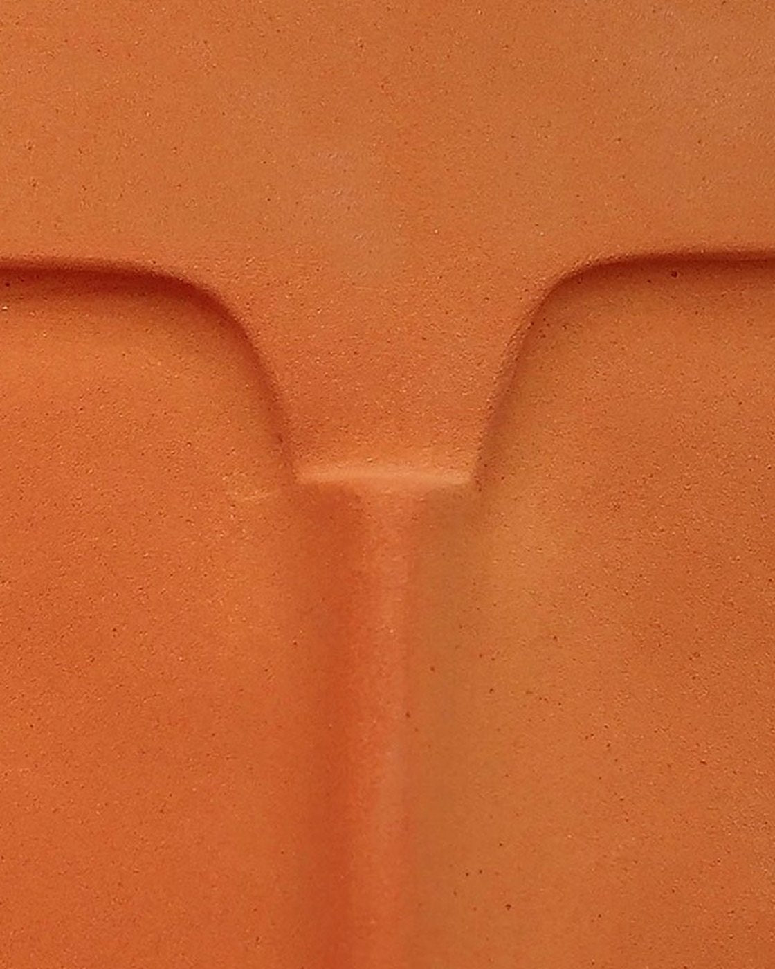 Close-up of the brow line and nose of the terracotta ceramic mask