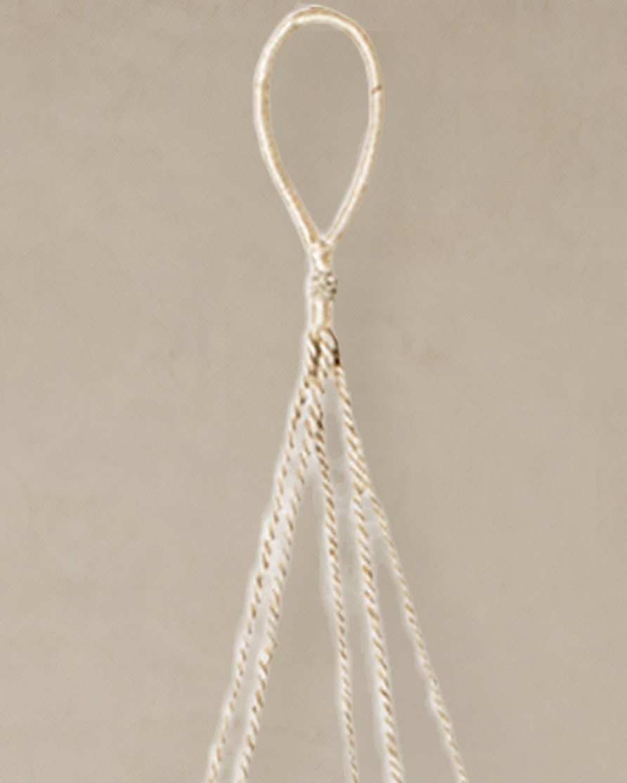 Close-up of the Nadu hanger’s braided jute loop and the cords below it