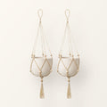 Nadu set of 2 jute macrame plant hangers with wooden beads, shown with plain pots (not included)