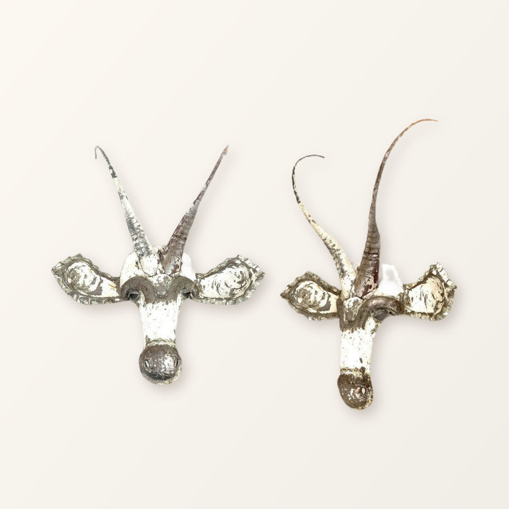 Two Sable masks showing how colour and horn shape vary from piece to piece; you receive one mask