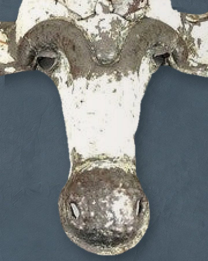 Close-up of the Sable mask’s brow, face and round metal nose, white paint worn back to bare metal
