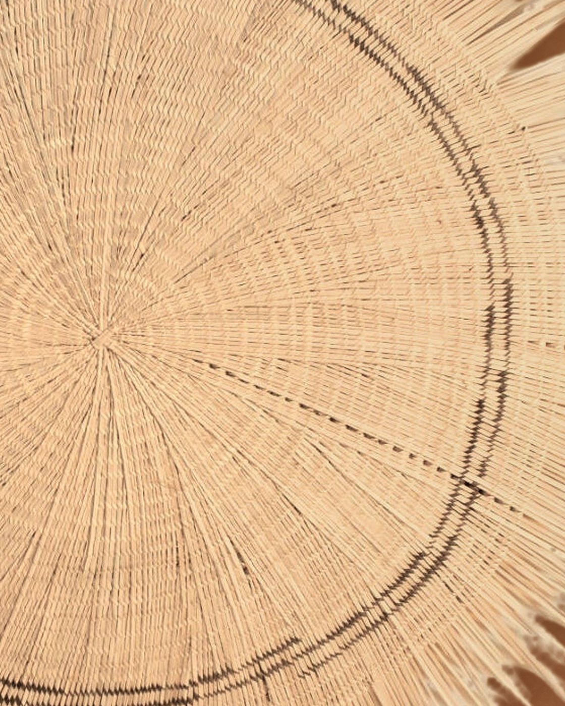 Close-up of the Sun Circle’s radial weave and the brown stripe that rings its center
