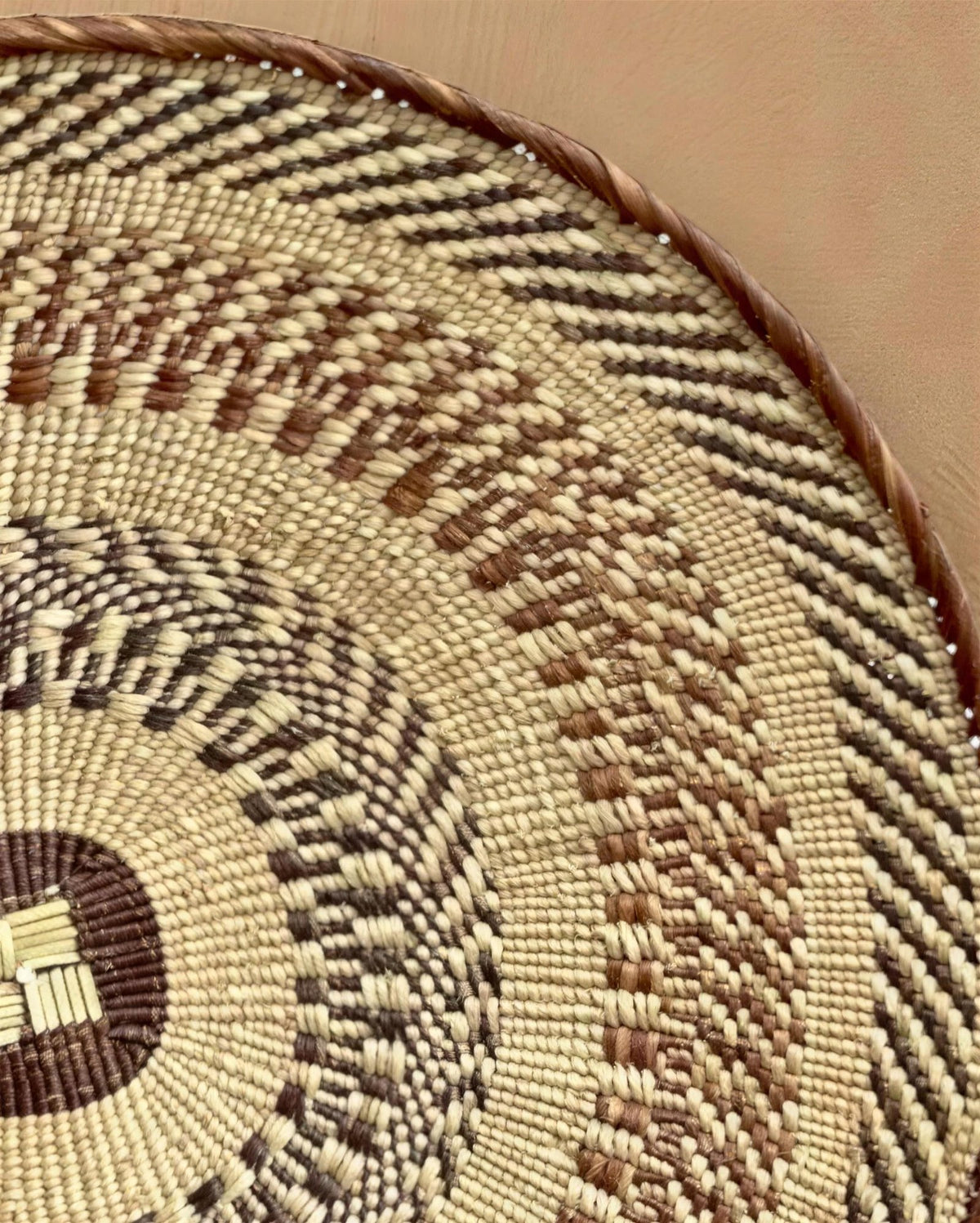 Close-up of a Tonga basket's coiled rim and woven pattern