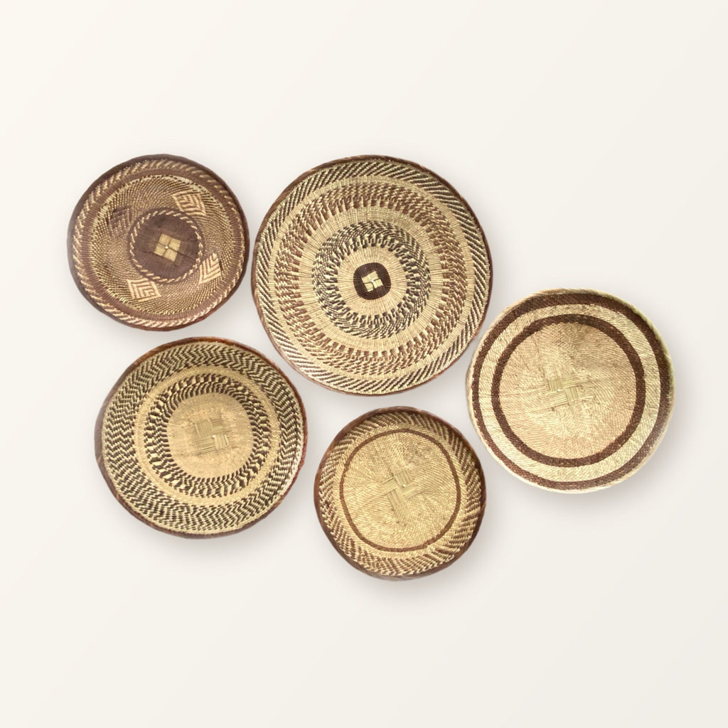 Tonga Wall Decor Basket Set of 5: five woven baskets in three sizes; patterns vary, so your set will differ