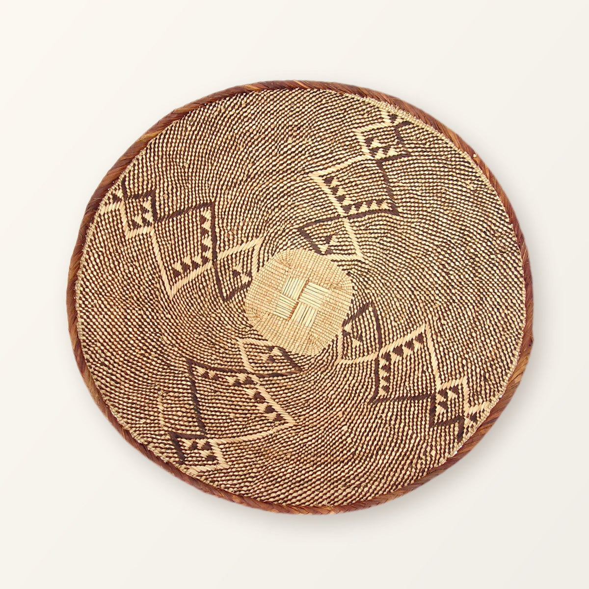 One Tonga basket up close, showing the coiled rim and woven pattern; an example only, patterns vary