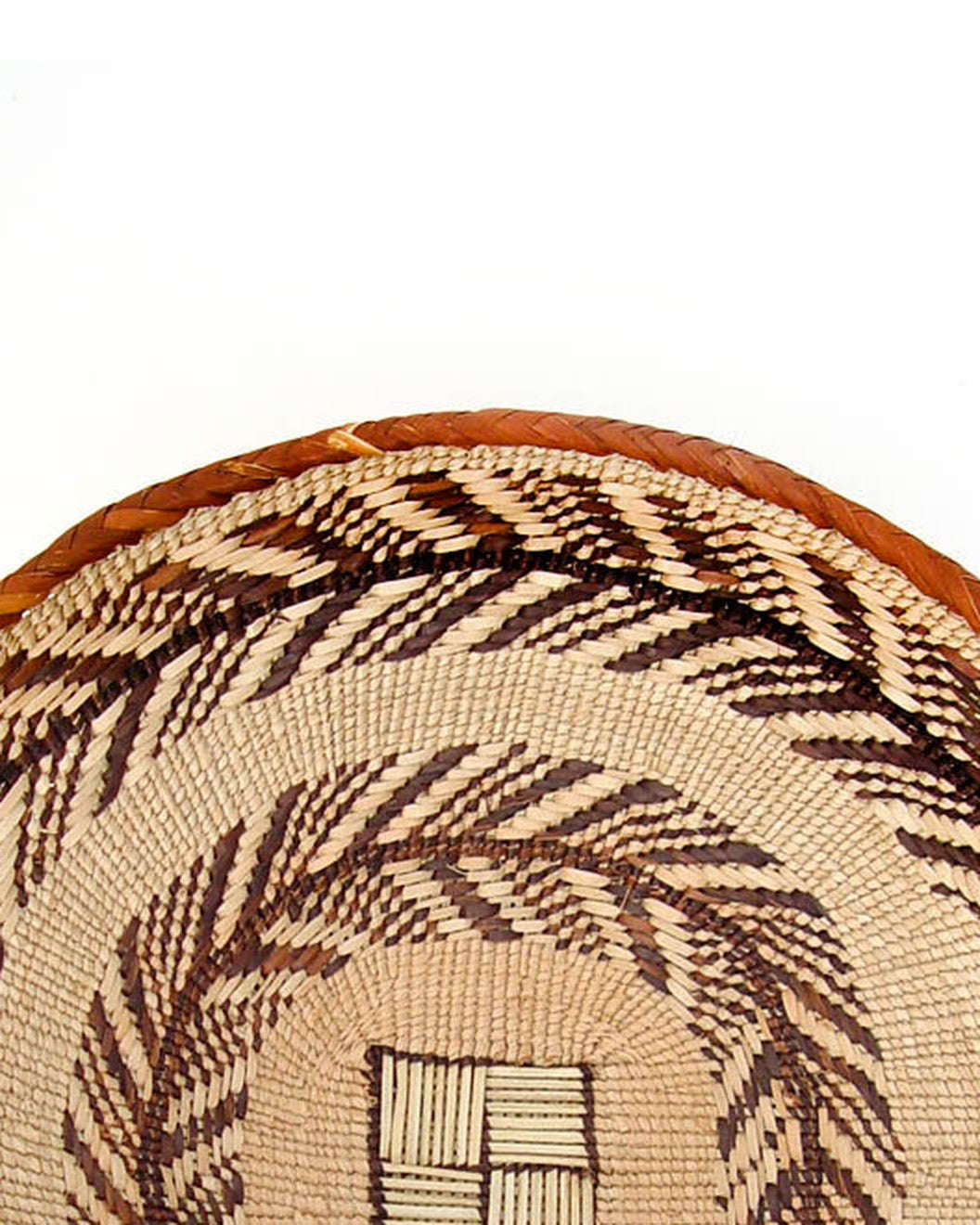 Close-up of a Tonga basket’s coiled rim and chevron weave (one example basket; patterns vary)