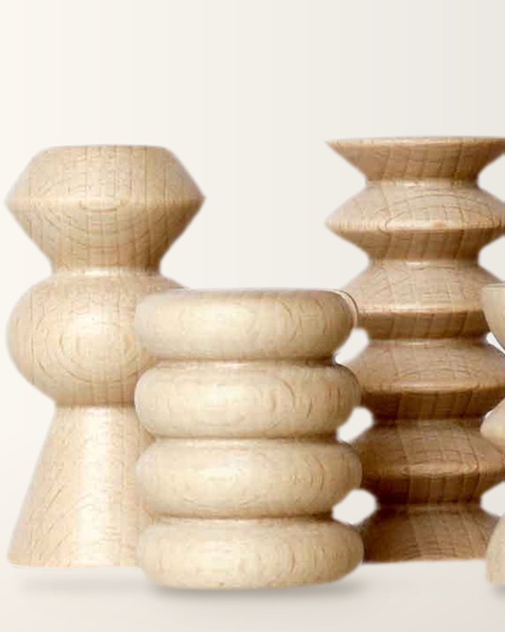 Close-up of three wooden Totem stands in different stacked, rounded shapes